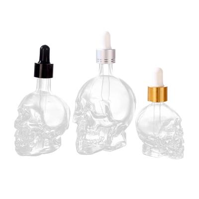 China 5ml 15ml 30ml 50ml Cosmetic Skull Shape Cosmetic Essential Oil Dropper Packaging Glass Bottle for sale