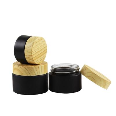 China 5g cosmetic 10g 15g 20g 30g 50g customized black empty cosmetic eye cream face glass jar with lid for sale