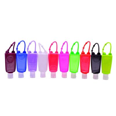 China Personal Care Products 30ml Clear Flip Cap Bottle Mini Hand Plastic Sanitizer Bottle With Colorful Silicone Cover for sale