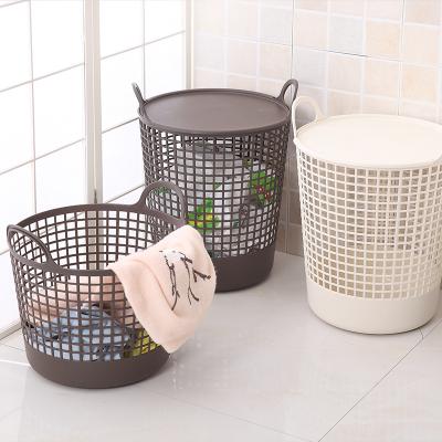 China New Household Wholesale Portable Storage Basket Creative Plastic Round Storage Basket With Lid for sale