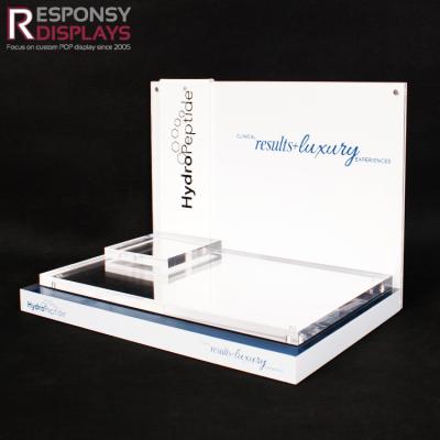 China Luxury Clear And White Acrylic Cosmetic Tabletop Display Stand With Mirror for sale