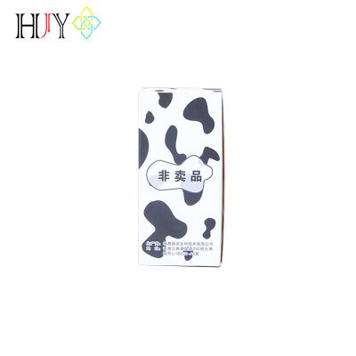 China Recycled materials custom wholesale price logo standard size paper packaging milk carton with cow pattern printing for sale