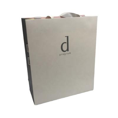 China Recyclable Custom Logo Printed Luxury Clothing Retail Packing Bag Gift Bag Shopping Paper Bags With Handles For Clothes for sale