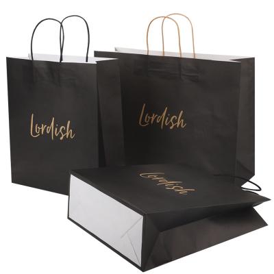 China Recyclable Gold Foil Hot Stamp Finished Black Paper Gift Bag With Custom Logo for sale