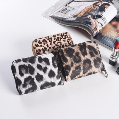 China Waterproof Women's Money Bag and Wallet Leopard Print PU Zipper Large Capacity Multi-Card Short Mobile Phone Bag for sale