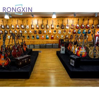 China Simple musical instruments shop interior design wooden guitar retail store display wall display cabinet showcase for guitar for sale