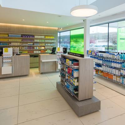 China MDF Modern Style Custom Pharmacy Store Shelves Pharmacy Case Design With Display Furniture for sale