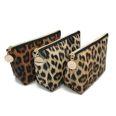 China Lightweight Cosmetics Bags For Travel Large Capacity Makeup Bag Dumpling Shape For Purse Bag Small Leopard Pouch Cute Gift For Women for sale