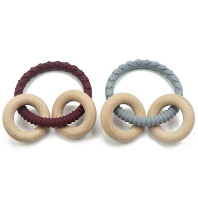 China Soft Silicone Natural Wood Customized Color Baby Teether Ring for sale