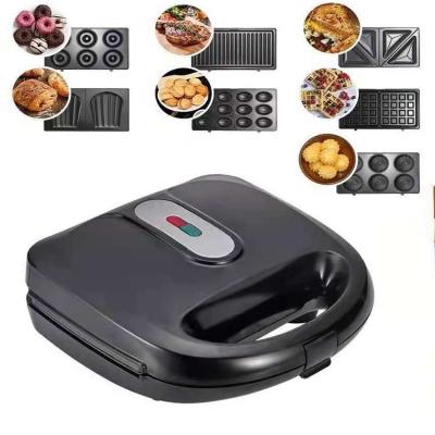 China Cool Touch Mini Electric Waffle Maker With Outdoor Nonstick Carbon Steel 750W 7 in 1 Double Sided Waffle Sandwich Panini Donut Bun Cookie Maker for sale