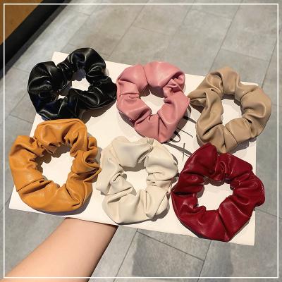 China Latest Design Fashion Color Leather PU Simple Elastic Hair Tie Promotional Pure Hair Scrunchies For Women for sale