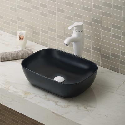 China Modern European Art Design Bathroom Sink Ceramic Black Hand Decorative Small Sink for sale