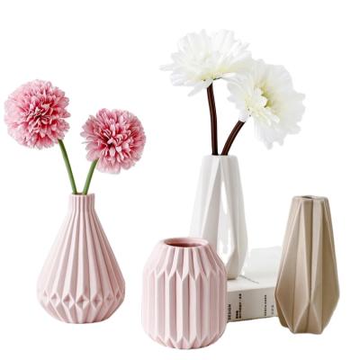 China Nordic minimalist creative sculpture decor flower vase home ceramic aritificial flower pot for wedding decoration for sale