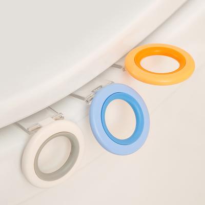 China Anti-dirty Clam Shell Holder Open Toilet Seat Handle Ring Toilet Cover Modern Toilet Lift Sticker Bathroom for sale