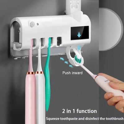 China Household USB Toothbrush Sterilizer Toothbrush Holder Double Layer Sterilizer Automatic Toothpaste Dispenser Wall Mounted Bathroom Tools for sale