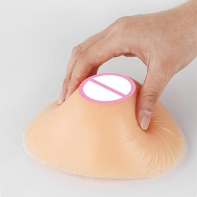 China Reusable Triangular Silicone Teardrop Shape Full Skin Color Artificial Breast Boobs for sale