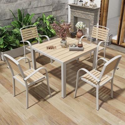 China Modern Design Style Outdoor Courtyard Table and Chair Set Made of Corrosion Resistant Wood-Plastic Material for Garden for sale