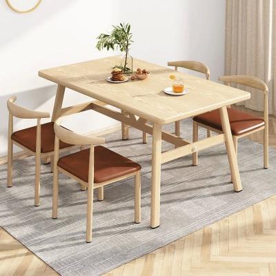 China Small Apartment Furniture 5-Piece Wood Dining Set with Iron Legs Modern Kitchen Table 4 Upholstered PU Chairs for sale