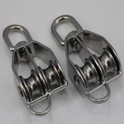 China Garment shops 304 stainless steel double wheel swivel pulley block with buckle for marine and industrial rigging aplications for sale