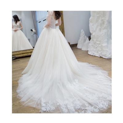 China Anti-Static Cutout High Quality Fine Printed Lace Tulle Long Sleeves Wedding Dress for sale