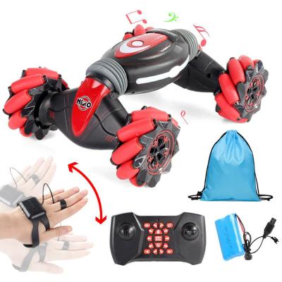 China Waterfall Climbing RC Hobby 2.4ghz 4wd Dual Remote Control Hand Watch Twist Gesture Sensor Transforming Motor Toy Car for sale