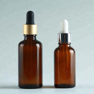 China 30ml Round Shape Cosmetic Amber Dropper Cap Cosmetic Oil Glass Bottle for sale