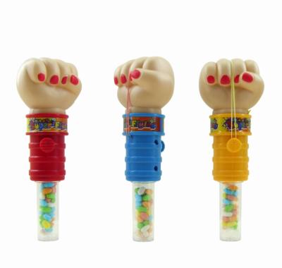 China Cartoon Toys Fist Spring Shooting Hand Toys Candy Dispenser With Kids Soft Candy Toys for sale