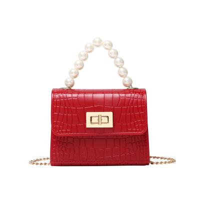 China 2021 New Fashion Crocodile Grain Pearl Ladies Wholesale Jelly Hand Bags for sale