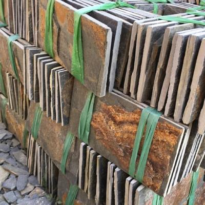 China New Modern Natural Rusty Black Green Gray Mushroom Chinese Panels Pile Stone Wall Cladding for sale