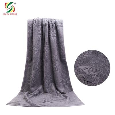 China Soft Wrapped 100% Cotton Bath Towel 50*70cm Single Color Jacquard Bath Towel Soft Water-absorbent Chest Can Be Customized Logo for sale