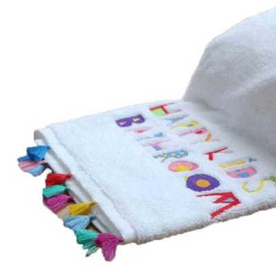 China New fashion product china compressed supplier embroidered logo tassel bath towel for sale