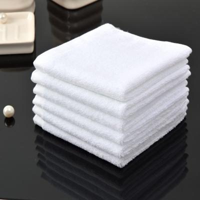 China Compressed Durable Super Cotton Absorbent 100% White Hotel Cleaning Towel for sale