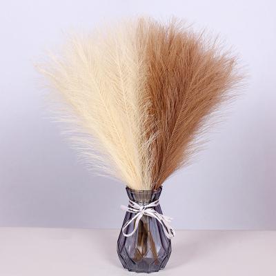 China Polyester cloth + iron wire + stain paper modern style decorative artificial pampas grass tubular reed for sale