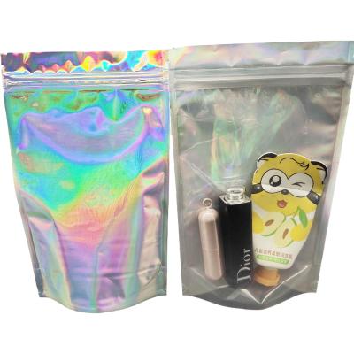 China Custom Size Front Clear Back Hologram Holographic Plastic Pouches Aluminum Foil Cosmetic Zipper Pouch Moisture Proof for sale