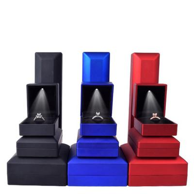 China Plastic Custom Boxes Logo Leather Travel Ring Necklace Luxury Blue Black New Small PU Led Jewelry Packaging Box for sale