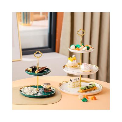 China European modern gold double edge creative three layer candy fruit cake dish string snack ceramic modern home storage dish for sale