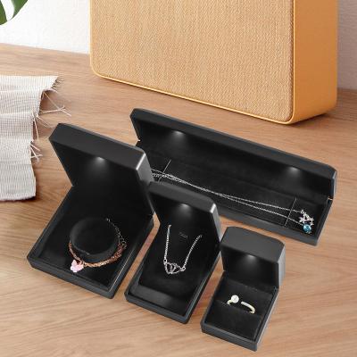 China Newest Jewelry Packaging Boxes Luxury Black Logo Gift Box Necklace Bracelet Custom Pendant Packaging Box With Led Light for sale