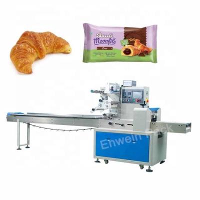 China Small Food Flow Package Machine For Croissant Bread Brownie Cake Packaging Machine for sale