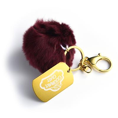 China Dial Pom Pom Keychain Luxury Cute Fur Ball Metal Keychain High Quality Custom Made Fur Keychain for sale