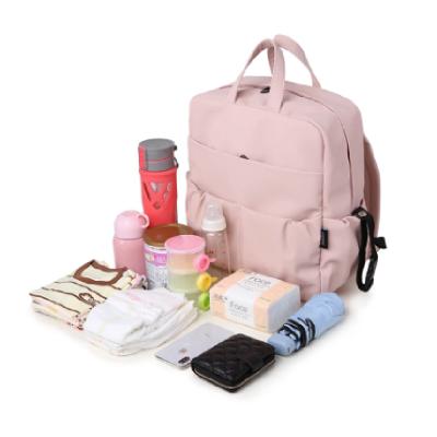 China Water Resistant Large Capacity Diaper Backpack For Newborn Baby Waterproof Cute Pink Diaper Bag For Mother for sale