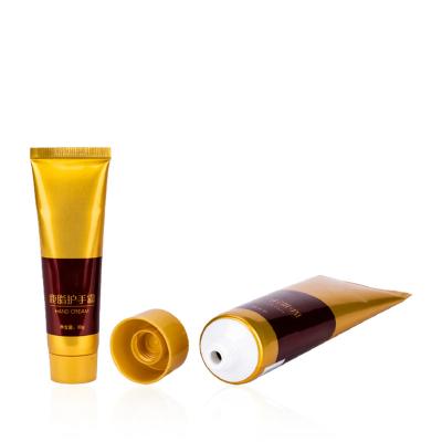 China 30ml Screw Lid Different Empty Plastic Squeeze Cosmetic Gold Plastic Bottles Glorious Shiny OEM Color Laminated Soft Cosmetic Tube for sale