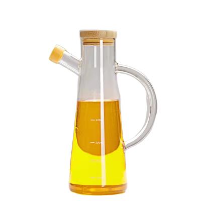 China Sustainable Heat Resistant High Borosilicate Glass Oil Dispenser Bottle With Handle For Kitchen for sale