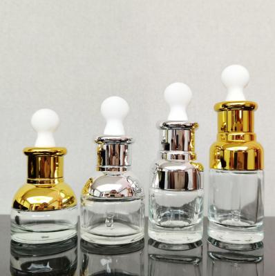 China Luxury Glass Bottle Pipette Dropper Bottle Gold 20ml 30ml 40ml Essential Oil Glass Bottle for sale