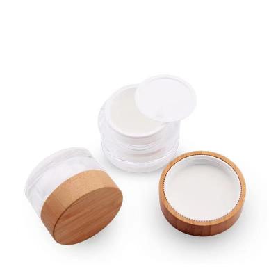 China Wholesale Cosmetic Container 5ml 15ml 30ml 50ml 100ml Glass Jar Face Cream Frosted Clear Glass Jar With Bamboo Wooden Lid for sale