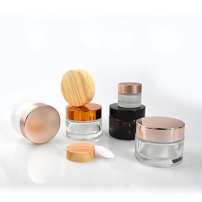 China Facial 50g Glass Bottle Jar 5g 100g 30g 10g 10ml 30ml Small White Black Gold Round Amber Clear Cosmetic Cream Glass Empty Frosted Jar for sale