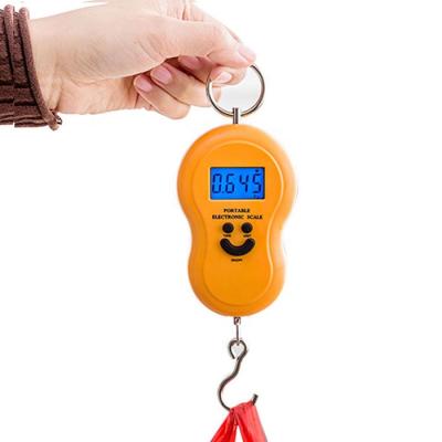 China Hot Selling Portable Weight Luggage Luggage Scale With Big Smile Travel Luggage Hanging Scale à venda