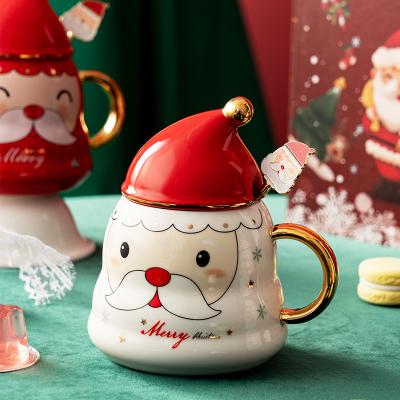 China 2021 New Style American Style Christmas Ceramic Mugs With Lid And Stainless Steel Rod Cute Cartoon Pattern Christmas Gift Stirring Coffee Mug for sale