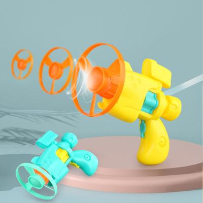 China Children's Toys Flying Saucer Gun with Light Other Toys Flying Disc Shooter Kids Bamboo Outdoor Sky Dragonfly Toy Guns for sale