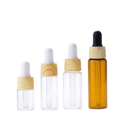 China Wholesale 10ml 15ml 20ml 30ml tube 1oz glass cosmetic amber dropper bottles for liquid/oil packaging with logo printing for sale