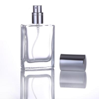 China Square High End Clear Glass Rectangle Serum Bottles 30ml 50ml 100ml Cosmetic Packing Glass Perfume Bottles With Spray Cap for sale